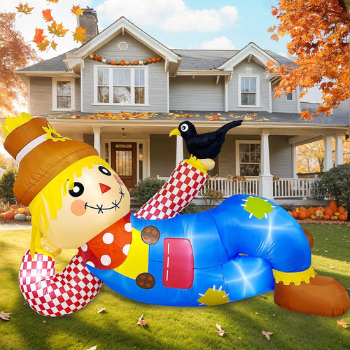 Inflatable scarecrow lounging on a lawn in a patchwork outfit with a black raven