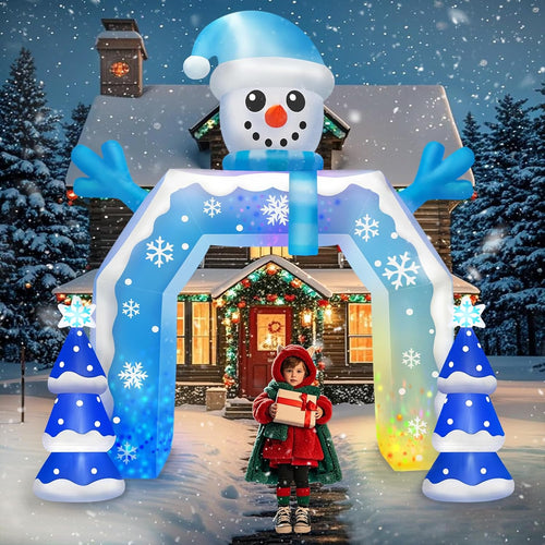 Blue inflatable archway with a snowman on top and blue lit trees, a child in red walking through