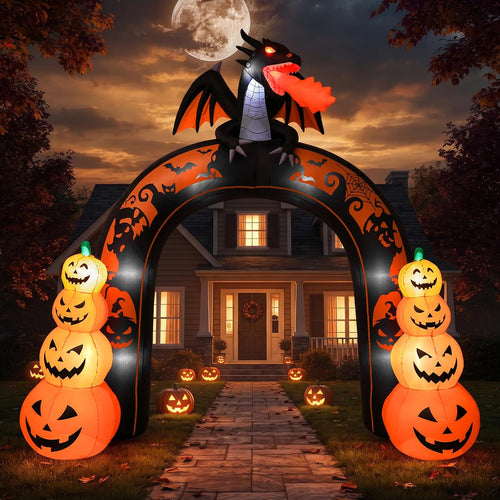 Inflatable Halloween archway with stacked glowing jack-o'-lanterns on each side and a black dragon on top over a front walk
